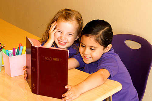 two children with book